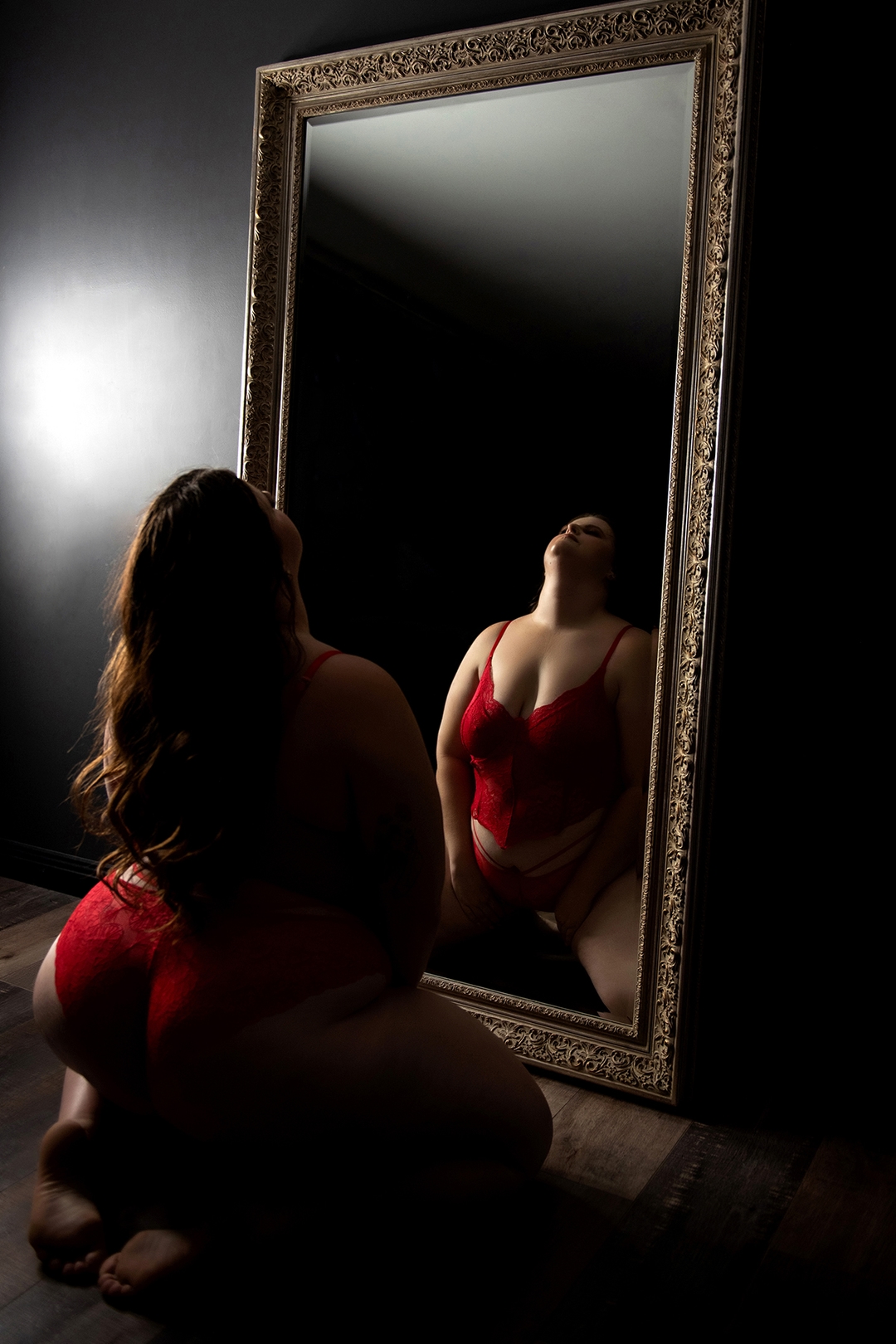 Large ornate mirror boudoir photoshoot - elegant reflection photography